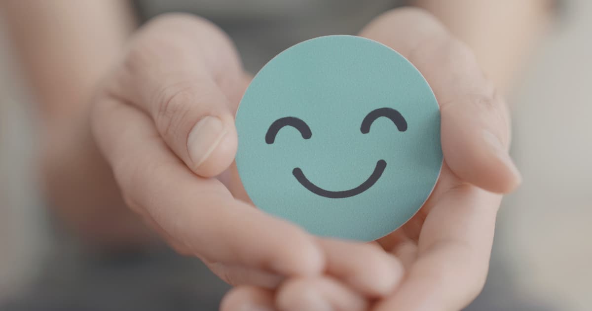 A person sitting calmly in a peaceful environment, representing the importance of mental health.